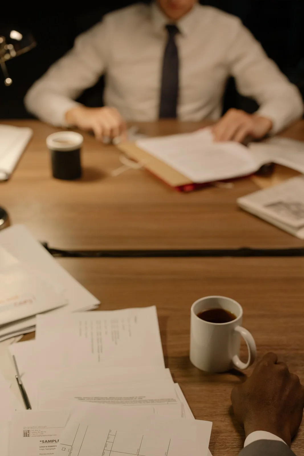 People reviewing paperwork at a table
